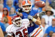 GAINESVILLE, FL - OCTOBER 17: Cornerback Andru Stewart #36 of the Arkansas Razorbacks breaks up a pass to wide receiver Riley Cooper #11 of the Florida Gators October 17, 2009 at Ben Hill Griffin Stadium in Gainesville, Florida.  (Photo by Al Messerschmidt/Getty Images)
