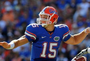 GAINESVILLE, FL - OCTOBER 17: Quarterback Tim Tebow #15 of the Florida Gators fumbles before passing in the first quarter against the University of Arkansas Razorbacks October 17, 2009 at Ben Hill Griffin Stadium in Gainesville, Florida.  (Photo by Al Messerschmidt/Getty Images)