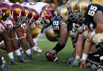 SOUTH BEND, IN - OCTOBER 17:  Braxston Cave #52 of the Notre Dame Fighting Irish prepares to snap the ball against the USC Trojans during the second quarter at Notre Dame Stadium on October 17, 2009 in South Bend, Indiana. (Photo by Jonathan Daniel/Getty Images)