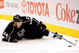 LOS ANGELES, CA - OCTOBER 06: Alexander Frolov #24 of the Los Angeles Kings reaches for the puck against San Jose Sharks during the NHL hockey game on October 6, 2009 in Los Angeles, California.  (Photo by Kevork Djansezian/Getty Images)