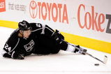 LOS ANGELES, CA - OCTOBER 06: Alexander Frolov #24 of the Los Angeles Kings reaches for the puck against San Jose Sharks during the NHL hockey game on October 6, 2009 in Los Angeles, California.  (Photo by Kevork Djansezian/Getty Images)