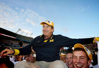 ORLANDO, FL - JANUARY 01:  Head coach Lloyd Carr of the Michigan Wolverines is carried off the field after ending his coaching career with a victory over the Florida Gators in the Capital One Bowl at Florida Citrus Bowl on January 1, 2008 in Orlando, Florida. Michigan defeated Florida 41-35.  (Photo by Doug Benc/Getty Images)