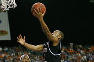 ATLANTA - MARCH 14:  Devan Downey #2 of the South Carolina Gamecocks makes a shot over Wayne Chism #4 of the Tennessee Volunteers during the SEC Men's Basketball Tournament on March 14, 2008 at the Georgia Dome in Atlanta, Georgia.  (Photo by Chris Graythen/Getty Images)
