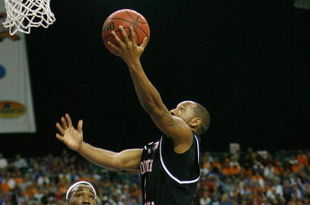 ATLANTA - MARCH 14:  Devan Downey #2 of the South Carolina Gamecocks makes a shot over Wayne Chism #4 of the Tennessee Volunteers during the SEC Men's Basketball Tournament on March 14, 2008 at the Georgia Dome in Atlanta, Georgia.  (Photo by Chris Graythen/Getty Images)