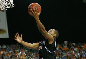 ATLANTA - MARCH 14:  Devan Downey #2 of the South Carolina Gamecocks makes a shot over Wayne Chism #4 of the Tennessee Volunteers during the SEC Men's Basketball Tournament on March 14, 2008 at the Georgia Dome in Atlanta, Georgia.  (Photo by Chris Graythen/Getty Images)