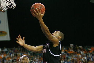ATLANTA - MARCH 14:  Devan Downey #2 of the South Carolina Gamecocks makes a shot over Wayne Chism #4 of the Tennessee Volunteers during the SEC Men's Basketball Tournament on March 14, 2008 at the Georgia Dome in Atlanta, Georgia.  (Photo by Chris Graythen/Getty Images)