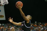 ATLANTA - MARCH 14:  Devan Downey #2 of the South Carolina Gamecocks makes a shot over Wayne Chism #4 of the Tennessee Volunteers during the SEC Men's Basketball Tournament on March 14, 2008 at the Georgia Dome in Atlanta, Georgia.  (Photo by Chris Graythen/Getty Images)