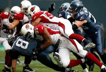 SEATTLE, WA - OCTOBER 18:  Quarterback Matt Hasselbeck #8 of the Seattle Seahawks is sacked by Calais Campbell #93 of the Arizona Cardinals at Qwest Field on October 18, 2009 in Seattle, Washington.  (Photo by Jonathan Ferrey/Getty Images)