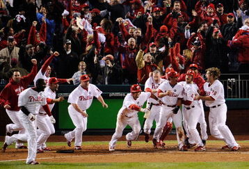 PHILADELPHIA - OCTOBER 19:  The Philadelphia Phillies celebrate after Carlos Ruiz scored the winning run on a walkoff 2-run double by Jimmy Rollins #11 in the bottom of the ninth inning to win 5-4 against the Los Angeles Dodgers in Game Four of the NLCS during the 2009 MLB Playoffs at Citizens Bank Park on October 19, 2009 in Philadelphia, Pennsylvania.  (Photo by Jeff Zelevansky/Getty Images)