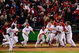 PHILADELPHIA - OCTOBER 19:  The Philadelphia Phillies celebrate after Carlos Ruiz scored the winning run on a walkoff 2-run double by Jimmy Rollins #11 in the bottom of the ninth inning to win 5-4 against the Los Angeles Dodgers in Game Four of the NLCS during the 2009 MLB Playoffs at Citizens Bank Park on October 19, 2009 in Philadelphia, Pennsylvania.  (Photo by Jeff Zelevansky/Getty Images)
