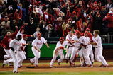 PHILADELPHIA - OCTOBER 19:  The Philadelphia Phillies celebrate after Carlos Ruiz scored the winning run on a walkoff 2-run double by Jimmy Rollins #11 in the bottom of the ninth inning to win 5-4 against the Los Angeles Dodgers in Game Four of the NLCS during the 2009 MLB Playoffs at Citizens Bank Park on October 19, 2009 in Philadelphia, Pennsylvania.  (Photo by Jeff Zelevansky/Getty Images)
