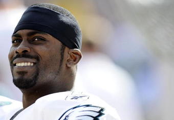 PHILADELPHIA - OCTOBER 11:  Michael Vick #7 of the Philadelphia Eagles sits on the sidelines before entering the game against the Tampa Bay Buccaneers at Lincoln Financial Field on October 11, 2009 in Philadelphia, Pennsylvania.  (Photo by Jeff Zelevansky/Getty Images)