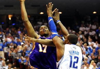 ORLANDO, FL - JUNE 14:  Andrew Bynum #17 of the Los Angeles Lakers goes up for a shot over Dwight Howard #12 of the Orlando Magic in the second quarter of Game Five of the 2009 NBA Finals on June 14, 2009 at Amway Arena in Orlando, Florida.  NOTE TO USER:  User expressly acknowledges and agrees that, by downloading and or using this photograph, User is consenting to the terms and conditions of the Getty Images License Agreement.  (Photo by Ronald Martinez/Getty Images)
