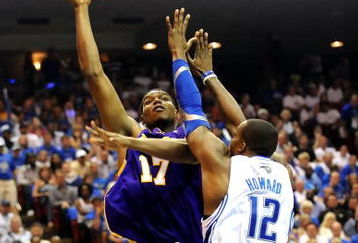 ORLANDO, FL - JUNE 14:  Andrew Bynum #17 of the Los Angeles Lakers goes up for a shot over Dwight Howard #12 of the Orlando Magic in the second quarter of Game Five of the 2009 NBA Finals on June 14, 2009 at Amway Arena in Orlando, Florida.  NOTE TO USER:  User expressly acknowledges and agrees that, by downloading and or using this photograph, User is consenting to the terms and conditions of the Getty Images License Agreement.  (Photo by Ronald Martinez/Getty Images)