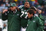 EAST RUTHERFORD, NJ - OCTOBER 18:  Kris Jenkins #77 of the New York Jets is helped off the field after being injured in the second quarter against the Buffalo Bills at Giants Stadium in the Meadowlands on October 18, 2009 in East Rutherford, New Jersey.  (Photo by Mike Stobe/Getty Images)