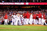 PHILADELPHIA - OCTOBER 21:  The Philadelphia Phillies celebrate defeating the Los Angeles Dodgers 10-4 to advance to the World Series in Game Five of the NLCS during the 2009 MLB Playoffs at Citizens Bank Park on October 21, 2009 in Philadelphia, Pennsylvania.  (Photo by Chris McGrath/Getty Images)