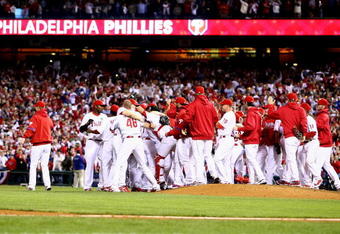 PHILADELPHIA - OCTOBER 21:  The Philadelphia Phillies celebrate defeating the Los Angeles Dodgers 10-4 to advance to the World Series in Game Five of the NLCS during the 2009 MLB Playoffs at Citizens Bank Park on October 21, 2009 in Philadelphia, Pennsylvania.  (Photo by Chris McGrath/Getty Images)