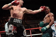 NOTTINGHAM, ENGLAND - OCTOBER 17:  Carl Froch (L) connects with a left hook as he retains his title against Andre Dirrell during their WBC Super Middleweight fight on October 17, 2009 at Trent FM Arena in Nottingham, England.  (Photo by John Gichigi/Getty Images)