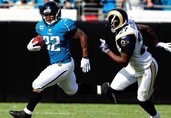 JACKSONVILLE, FL - OCTOBER 18:  Maurice Jones-Drew #32 of the Jacksonville Jaguars is chased by David Roach #27 of the St. Louis Rams during the game at Jacksonville Municipal Stadium on October 18, 2009 in Jacksonville, Florida.  (Photo by Sam Greenwood/Getty Images)