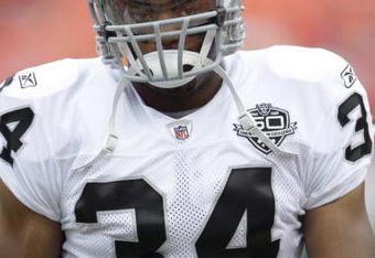 KANSAS CITY, MO - SEPTEMBER 20:  Mike Mitchell #34 of the Oakland Raiders looks on before the game against the Kansas City Chiefs at Arrowhead Stadium on September 20, 2009 in Kansas City, Missouri. (Photo by Jamie Squire/Getty Images)