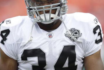 KANSAS CITY, MO - SEPTEMBER 20:  Mike Mitchell #34 of the Oakland Raiders looks on before the game against the Kansas City Chiefs at Arrowhead Stadium on September 20, 2009 in Kansas City, Missouri. (Photo by Jamie Squire/Getty Images)