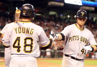 PHOENIX - JULY 23:  Ryan Doumit #41 of the Pittsburgh Pirates is congratulated by teammate Delwyn Young #48 after Doumit hit a two run home run against the Arizona Diamondbacks during the fifth inning of the major league baseball game at Chase Field on July 23, 2009 in Phoenix, Arizona.  (Photo by Christian Petersen/Getty Images)