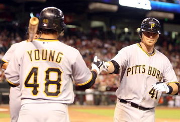 PHOENIX - JULY 23:  Ryan Doumit #41 of the Pittsburgh Pirates is congratulated by teammate Delwyn Young #48 after Doumit hit a two run home run against the Arizona Diamondbacks during the fifth inning of the major league baseball game at Chase Field on July 23, 2009 in Phoenix, Arizona.  (Photo by Christian Petersen/Getty Images)