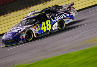 CONCORD, NC - OCTOBER 17:  Jimmie Johnson, driver of the #48 Lowe's Chevrolet, races Jeff Gordon, driver of the #24 DuPont/Transformers Chevrolet, during the closing laps of the NASCAR Sprint Cup Series NASCAR Banking 500 at Lowe's Motor Speedway on October 17, 2009 in Concord, North Carolina.  (Photo by Geoff Burke/Getty Images for NASCAR)