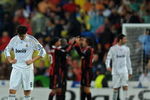 MADRID, SPAIN - OCTOBER 21:  Kaka (L) of Real Madrid stands dejected after conceding a goal as AC Milan players celebrate in the background during the Champions League group C match between Real Madrid and AC Milan at the Estadio Santiago Bernabeu on October 21, 2009 in Madrid, Spain. AC Milan won the match 3-2.  (Photo by Jasper Juinen/Getty Images)