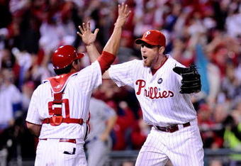 PHILADELPHIA - OCTOBER 21:  Brad Lidge #54 and Carlos Ruiz #51 of the Philadelphia Phillies celebrate defeating the Los Angeles Dodgers 10-4 to advance to the World Series in Game Five of the NLCS during the 2009 MLB Playoffs at Citizens Bank Park on October 21, 2009 in Philadelphia, Pennsylvania.  (Photo by Jeff Zelevansky/Getty Images)