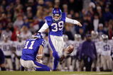 LAWRENCE, KS - NOVEMBER 18:  Kicker Scott Webb #39 of the Kansas Jayhawks kicks a field goal against the Kansas State Wildcats in the fourth quarter at Memorial Stadium November 18, 2006 in Lawrence, Kansas. The Kansas Jayhawks won 39-20.  (Photo by Brian Bahr/Getty Images)