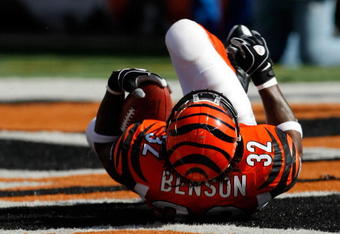 CINCINNATI, OH - OCTOBER 18: Running back Cedric Benson #32 of the Cincinnati Bengals lays on the field as he celebrates  a touchdown in the 2nd quarter against the Houston Texans at Paul Brown Stadium on October 18, 2009 in Cincinnati, Ohio. (Photo by Scott Boehm/Getty Images)