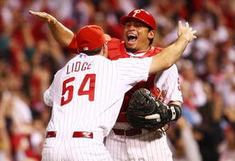 PHILADELPHIA - OCTOBER 21:  Brad Lidge #54 and Carlos Ruiz #51 of the Philadelphia Phillies celebrate defeating the Los Angeles Dodgers 10-4 to advance to the World Series in Game Five of the NLCS during the 2009 MLB Playoffs at Citizens Bank Park on October 21, 2009 in Philadelphia, Pennsylvania.  (Photo by Chris McGrath/Getty Images)
