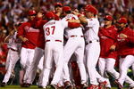 PHILADELPHIA - OCTOBER 21:  The Philadelphia Phillies celebrate defeating the Los Angeles Dodgers 10-4 to advance to the World Series in Game Five of the NLCS during the 2009 MLB Playoffs at Citizens Bank Park on October 21, 2009 in Philadelphia, Pennsylvania.  (Photo by Chris McGrath/Getty Images)