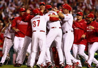 PHILADELPHIA - OCTOBER 21:  The Philadelphia Phillies celebrate defeating the Los Angeles Dodgers 10-4 to advance to the World Series in Game Five of the NLCS during the 2009 MLB Playoffs at Citizens Bank Park on October 21, 2009 in Philadelphia, Pennsylvania.  (Photo by Chris McGrath/Getty Images)