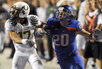 BOISE, ID - SEPTEMBER 3:  Willie Glasper #17 of the Oregon Ducks battles for position with Mitch Burroughs #20 of the Boise State as a pass is thrown in second quarter of the game on September 3, 2009 at Broncos Stadium in Boise, Idaho. Boise State won the game 19-8. (Photo by Steve Dykes/Getty Images)