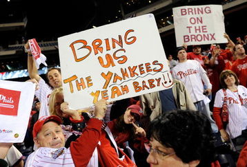 PHILADELPHIA - OCTOBER 21:  Fans of the Philadelphia Phillies hold up signs which call for the Phillies to play against the New York Yankees in the World Series after the Phillies advanced to the series with their 10-4 against the Los Angeles Dodgers in Game Five of the NLCS during the 2009 MLB Playoffs at Citizens Bank Park on October 21, 2009 in Philadelphia, Pennsylvania.  (Photo by Jeff Zelevansky/Getty Images)