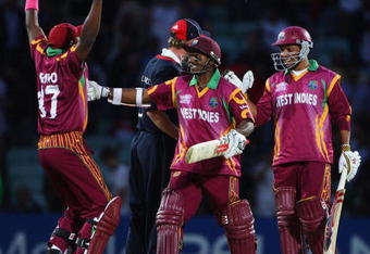 LONDON, ENGLAND - JUNE 15:  Ramnaresh Sarwan (R) and Shivnarine Chanderpaul of West Indies celebrate victory with Dwayne Bravo (L) during the ICC World Twenty20 Super Eights match between England and West Indies at the Brit Oval on June 15, 2009 in London, England.  (Photo by Tom Shaw/Getty Images)