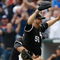 CHICAGO, IL - JULY 23: Pitcher Mark Buehrle #56 of the Chicago White Sox celebrates after pitching a perfect game as he is grabbed by first baseman Josh Fields #7 against the Tampa Bay Rays at U.S. Cellular Field on July 23, 2009 in Chicago, Illinois. The White Sox defeated the Rays 5-0, as Buehrle became the 18th pitcher in 132 years of major league baseball to throw a perfect game. (Photo by Scott Boehm/Getty Images)