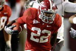 TUSCALOOSA - OCTOBER 17:  Running back Mark Ingram #22 of the Alabama Crimson Tide breaks through the line of scrimmage on a running play during the game against the South Carolina Gamecocks at Bryant-Denny Stadium on October 17, 2009 in Tuscaloosa, Alabama.  The Crimson Tide beat the Gamecocks 20-6.  (Photo by Mike Zarrilli/Getty Images)