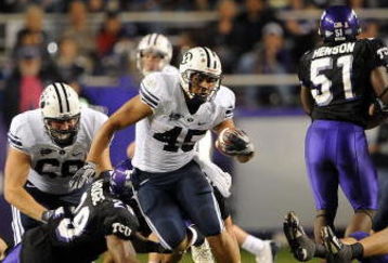 FORT WORTH, TX - OCTOBER 16:  Running back Harvey Unga #45 of the BYU Cougars runs against the TCU Horned Frogs at Amon G. Carter Stadium on October 16, 2008 in Fort Worth, Texas.  (Photo by Ronald Martinez/Getty Images)