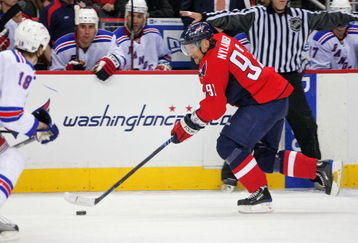WASHINGTON - APRIL 15:  Michael Nylander #92 of the Washington Capitals skates the puck along the boards against the New York Rangers during Game One of the Eastern Conference Quarterfinals Round of the 2009 Stanley Cup Playoffs on April 15, 2009 at the Verizon Center in Washington,  DC.  (Photo by Len Redkoles/Getty Images)