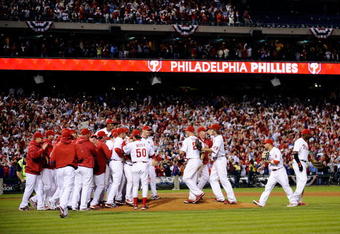 PHILADELPHIA - OCTOBER 21:  The Philadelphia Phillies celebrate defeating the Los Angeles Dodgers 10-4 to advance to the World Series in Game Five of the NLCS during the 2009 MLB Playoffs at Citizens Bank Park on October 21, 2009 in Philadelphia, Pennsylvania.  (Photo by Jeff Zelevansky/Getty Images)