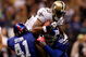 NEW ORLEANS - OCTOBER 18: Marques Colston #12 of the New Orleans Saints makes a catch at the 1 yard line as he is tackled by C.C. Brown #41 and Antonio Pierce #58 of the New York Giants at the Louisiana Superdome on October 18, 2009 in New Orleans, Louisiana. (Photo by Chris Graythen/Getty Images)