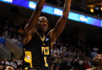 PHILADELPHIA - MARCH 19:  Larry Sanders #1 of the VCU Rams slam dunks against Alfred Aboya #12 of the UCLA Bruins during the first round of the NCAA Division I Men's Basketball Tournament at the Wachovia Center on March 19, 2009 in Philadelphia, Pennsylvania.  (Photo by Jim McIsaac/Getty Images)