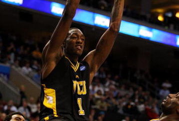 PHILADELPHIA - MARCH 19:  Larry Sanders #1 of the VCU Rams slam dunks against Alfred Aboya #12 of the UCLA Bruins during the first round of the NCAA Division I Men's Basketball Tournament at the Wachovia Center on March 19, 2009 in Philadelphia, Pennsylvania.  (Photo by Jim McIsaac/Getty Images)