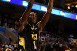 PHILADELPHIA - MARCH 19:  Larry Sanders #1 of the VCU Rams slam dunks against Alfred Aboya #12 of the UCLA Bruins during the first round of the NCAA Division I Men's Basketball Tournament at the Wachovia Center on March 19, 2009 in Philadelphia, Pennsylvania.  (Photo by Jim McIsaac/Getty Images)