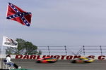 18 Mar 2001: Beneath the old Confederate States flag the the 'stars and bars'' a fan watches the racers flash past the wall during the NASCAR Winston Cup Carolina Dodge Dealers 400 at the Darlington Raceway, Darlington, South Carolina. Mandatory Credit: Donald Miralle/ALLSPORT