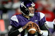 EVANSTON, IL - NOVEMBER 11:  Vernon Gholston #50 of the Ohio State Buckeyes closes in on a sack against Mike Kafka #13 of the Northwestern Wildcats on November 11, 2006 at Ryan Field in Evanston, Illinois. Ohio State defeated Northwestern 54-10.  (Photo by Jonathan Daniel/Getty Images)