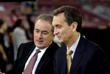 TAMPA, FL - OCTOBER 19: NBC commentators Cris Collinsworth and Al Michaels reports from the sidelines as the Tampa Bay Buccaneers host the Seattle Seahawks at Raymond James Stadium on October 19, 2008 in Tampa, Florida.  (Photo by Al Messerschmidt/Getty Images) 